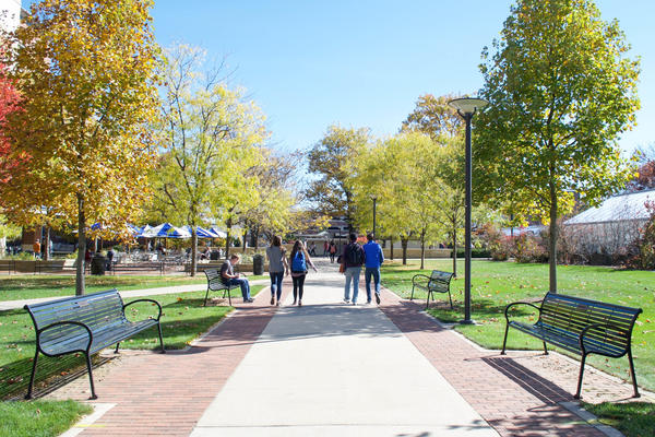 campus in the fall with students walking